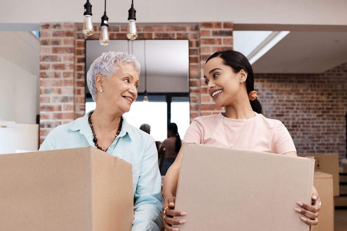 Mother helping daughter learn about major financial decisions when moving away from home.