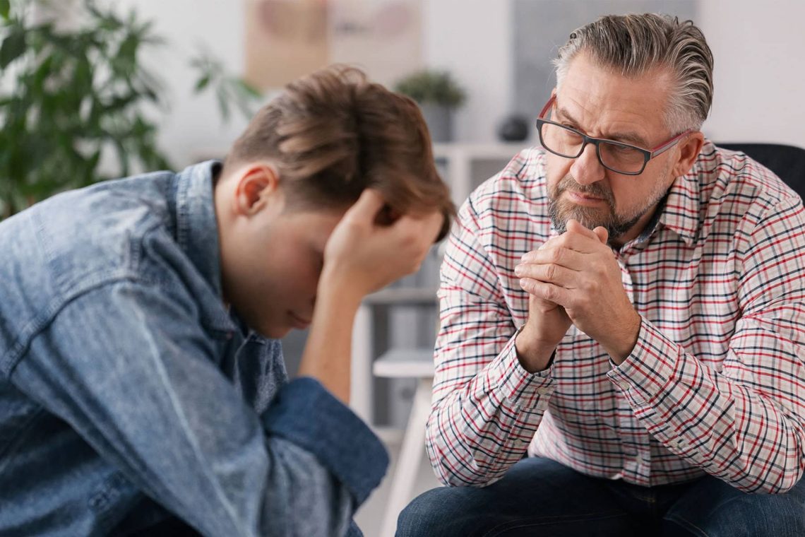 Eddy And Schein Talking To Son Finances Shutterstock 1659333346
